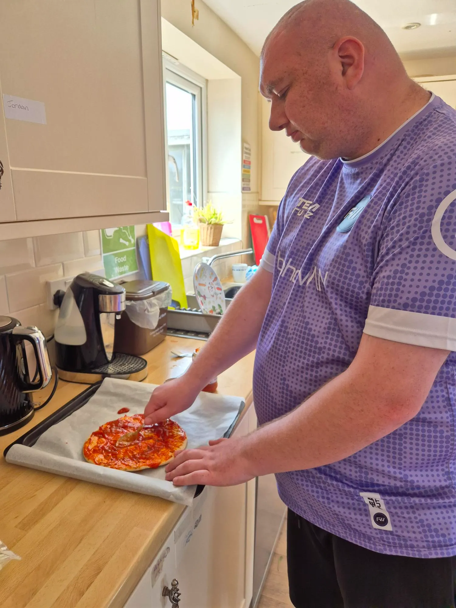 Learner making pizza with their friends